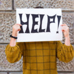 child holding a sign