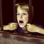 child-behind-bars-FI