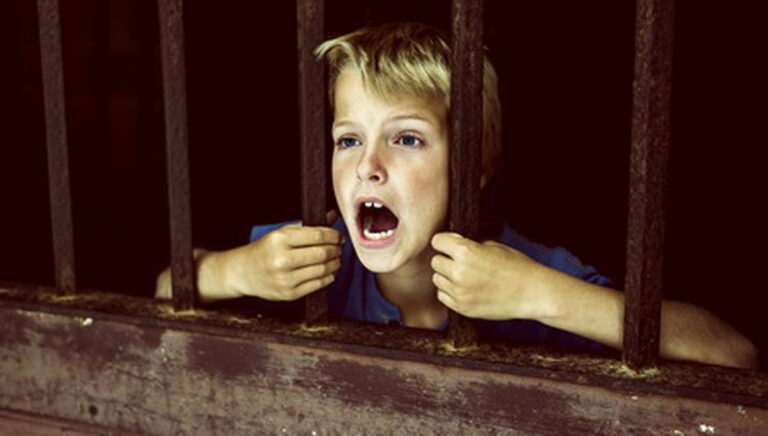 child-behind-bars-FI